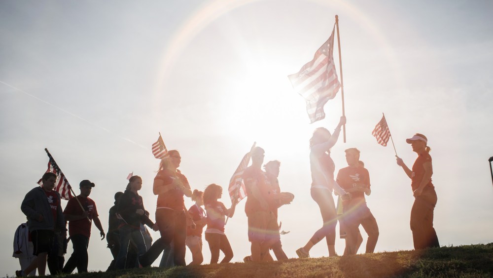 Active members of the military, veterans and civilians march to pay tribute to the victims and families affected by the Fort Hood shooting, April 4, 2014, in Killeen, Texas.