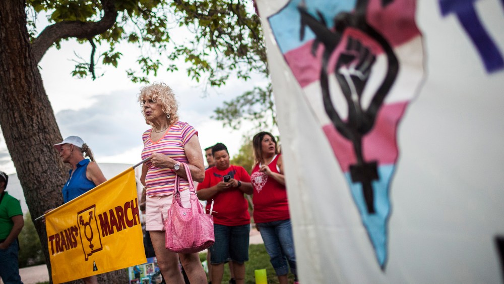 In this May 29, 2014 photo, Denee Mallon, second from left, takes part in the Trans March to Morningside Park in Albuquerque, N.M.