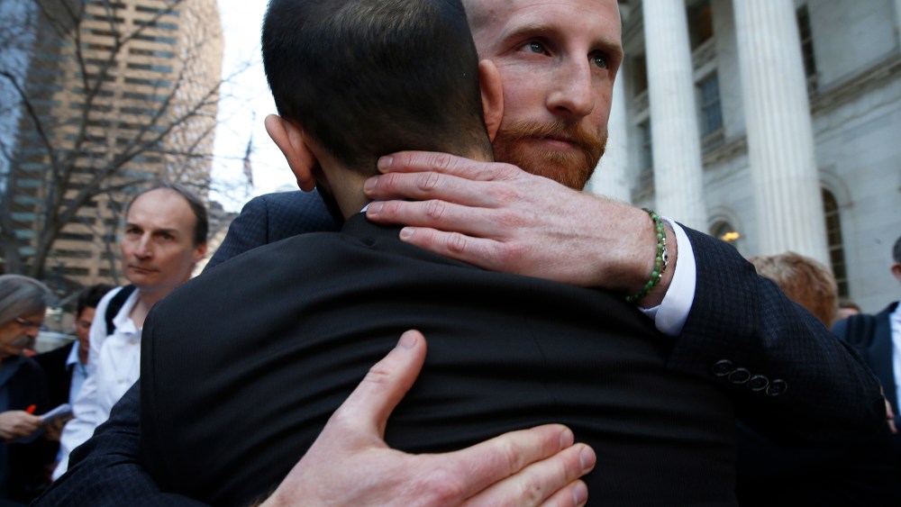 Derek Kitchen, right, and his partner Moudi Sbeity, the plaintiffs challenging Utah's gay marriage ban, hug after leaving court following a hearing at the U.S. Circuit Court of Appeals in Denver, April 10, 2014.