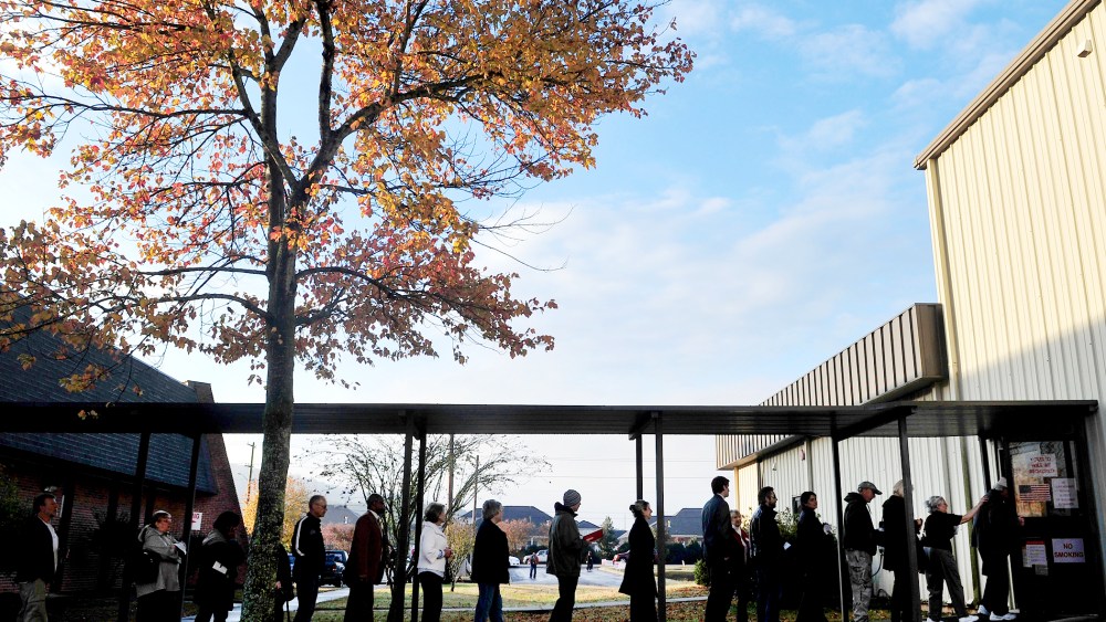 Voters line up and wait for the doors to open at Dwelling Place Church in Huntsvilla, Ala., Nov. 6, 2012.
