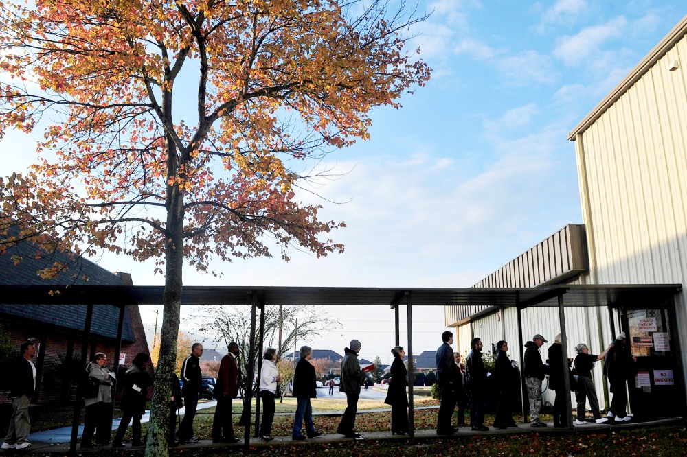 Voters line up and wait for the doors to open at Dwelling Place Church in Huntsvilla, Ala., Nov. 6, 2012.