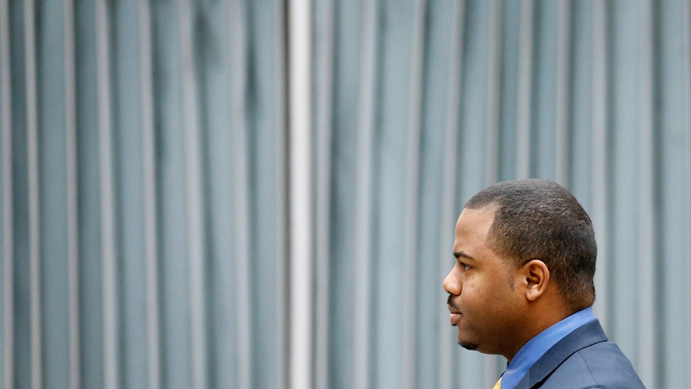 William Porter, one of six Baltimore city police officers charged in connection to the death of Freddie Gray, walks to a courthouse for jury selection in his trial, Nov. 30, 2015, in Baltimore. (Photo by Patrick Semansky/AP)