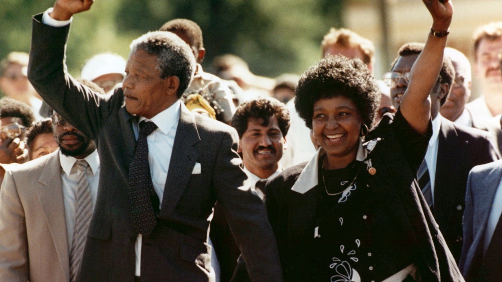 Nelson Mandela and his wife, Winnie, raise clenched fists as they walk hand-in-hand upon his release from prison in Cape Town, South Africa on Feb. 11, 1990.