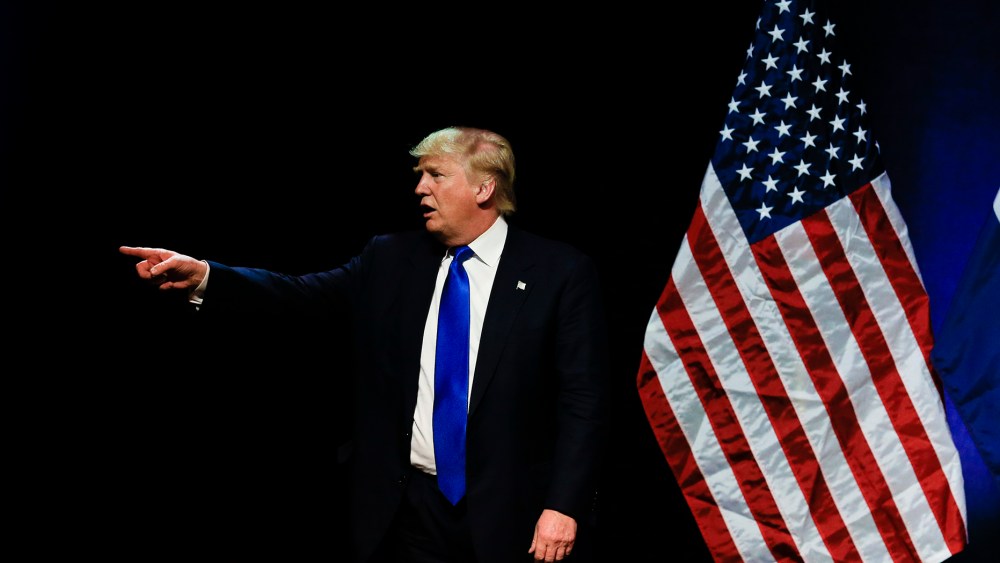 Republican presidential candidate Donald Trump points towards a demonstrator in the audience as he spoke at an election rally in Kansas City, Mo., March 12, 2016. (Photo by Nati Harnik/AP)