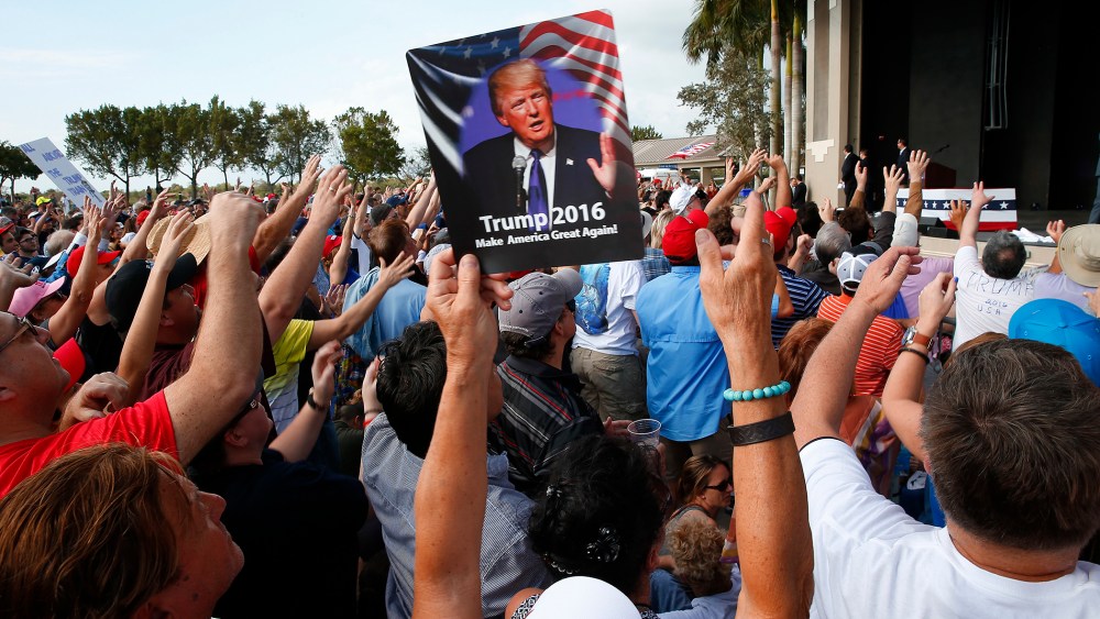 Audience members cheer at a Republican presidential candidate Donald Trump campaign rally in Boca Raton, Fl., March 13, 2016. (Photo by Paul Sancya/AP)