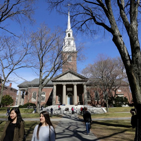 People walk near Memorial Church on the campus of Harvard University, in Cambridge, Mass., March 13, 2016. (Photo by Steven Senne/AP)