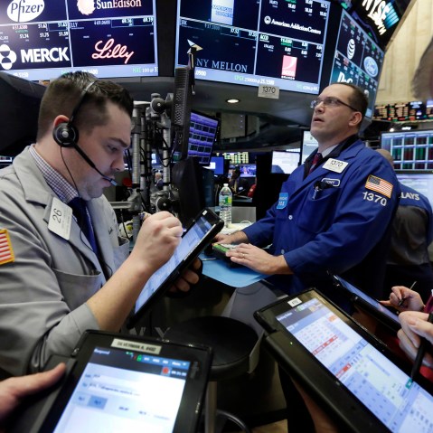 Traders on the floor of the N.Y. Stock Exchange, March 18, 2016. U.S. stocks opened higher again, setting the market up to extend its winning streak to a fifth week and erasing most of the year's early losses. (Photo by Richard Drew/AP)