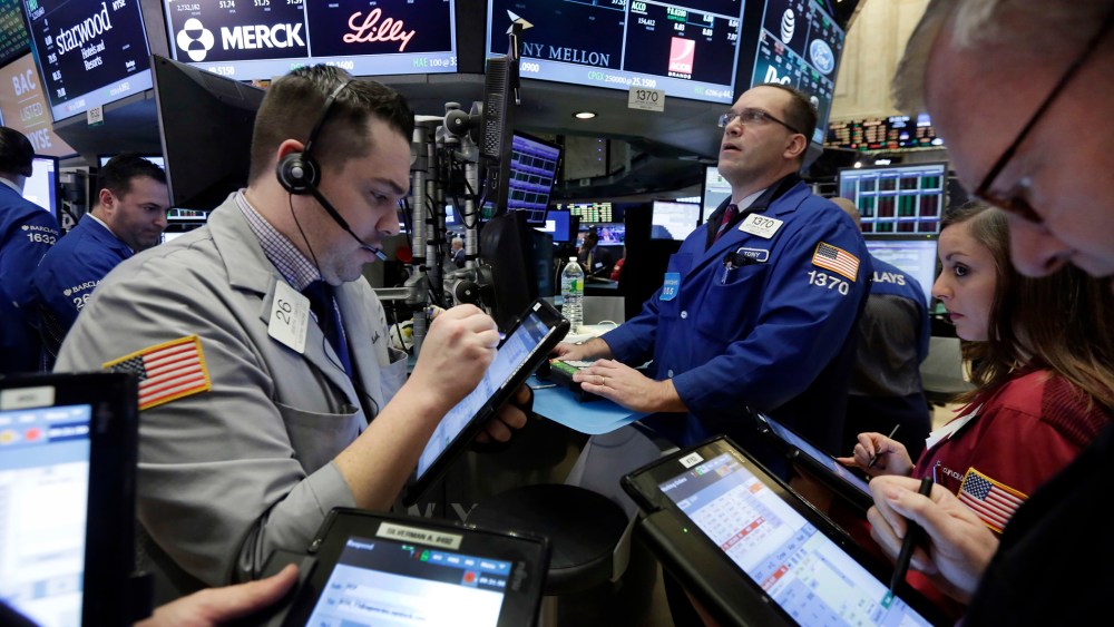 Traders on the floor of the N.Y. Stock Exchange, March 18, 2016. U.S. stocks opened higher again, setting the market up to extend its winning streak to a fifth week and erasing most of the year's early losses. (Photo by Richard Drew/AP)