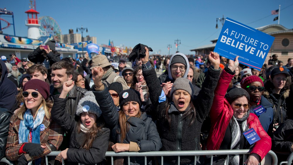 Supporters cheers as Democratic presidential candidate, Sen. Bernie Sanders, I-Vt., speaks during a rally on the Coney Island boardwalk in the Brooklyn borough of New York, April 10, 2016. (Photo by Mary Altaffer/AP)