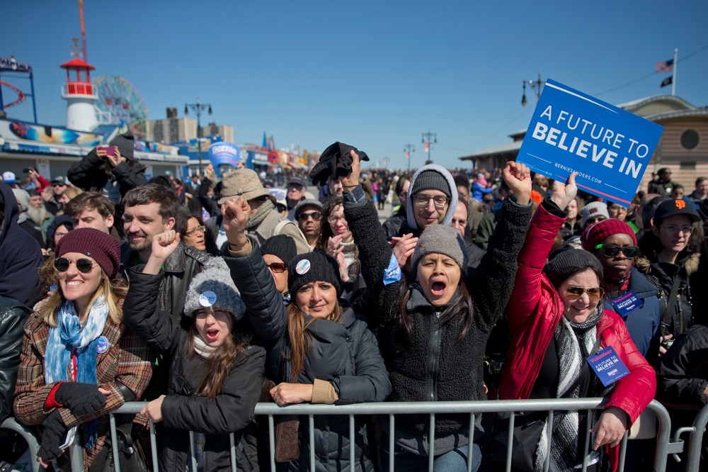 Supporters cheers as Democratic presidential candidate, Sen. Bernie Sanders, I-Vt., speaks during a rally on the Coney Island boardwalk in the Brooklyn borough of New York, April 10, 2016. (Photo by Mary Altaffer/AP)
