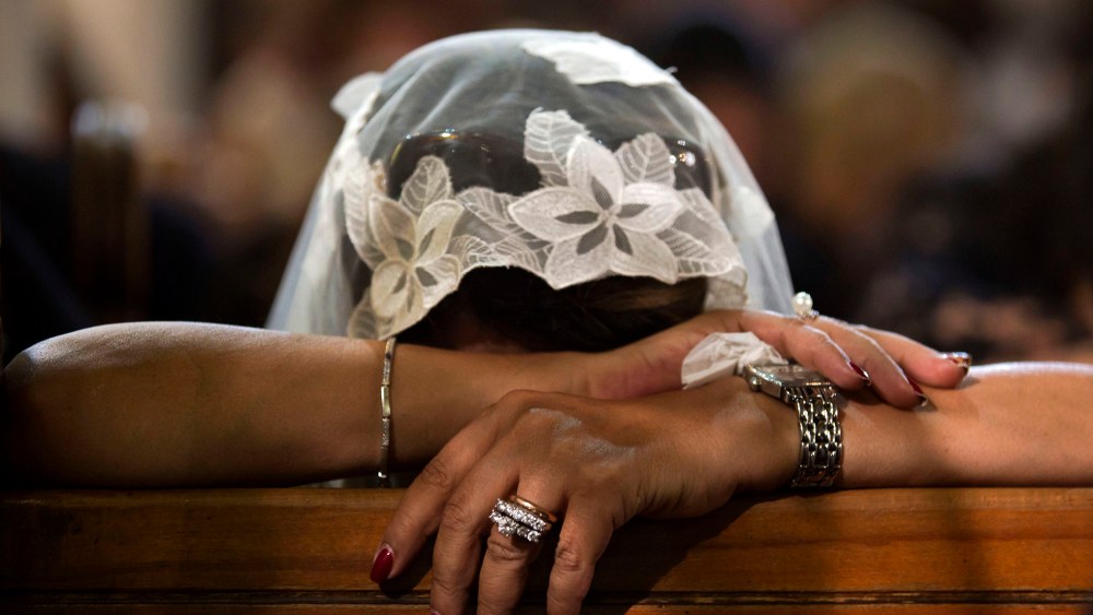 A Coptic Christian grieves during prayers for the departed, remembering the victims of Thursday's crash of EgyptAir flight 804, at Al-Boutrossiya Church, the main Coptic Cathedral complex, in Cairo, Egypt, May 22, 2016. (Photo by Amr Nabil/AP)