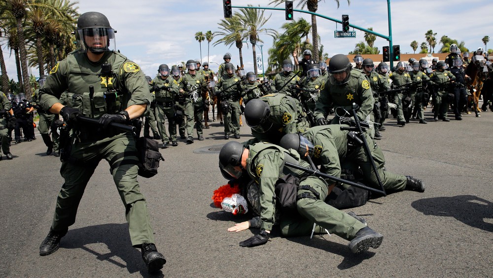 Orange County Sheriff's deputies take a protester into custody near the Anaheim Convention Center, May 25, 2016, in Anaheim, Calif. Republican presidential candidate Donald Trump held a rally at the convention center. (Photo by Jae C. Hong/AP)