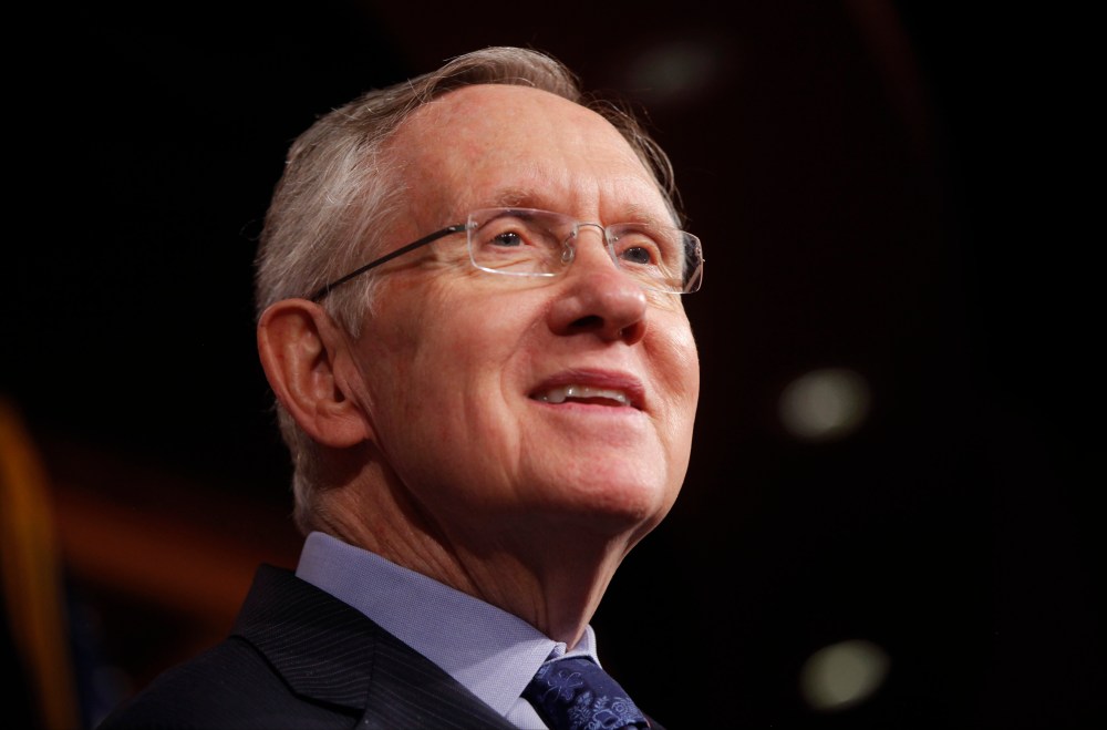 Senate Majority Leader Harry Reid of Nevada listens to a reporter's question about their meeting with Senate Republicans regarding the government shutdown and debt ceiling on Capitol Hill in Washington, Saturday, Oct. 12, 2013.