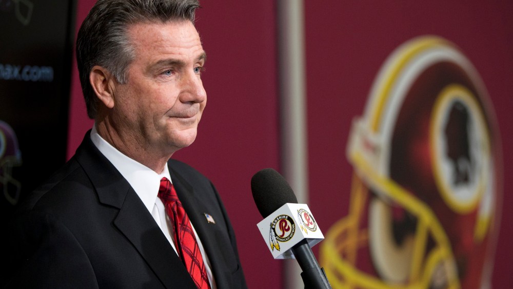 Washington Redskins Executive Vice President and General Manager Bruce Allen listens to a question during a news conference, Dec. 30, 2013, in Ashburn, Va.