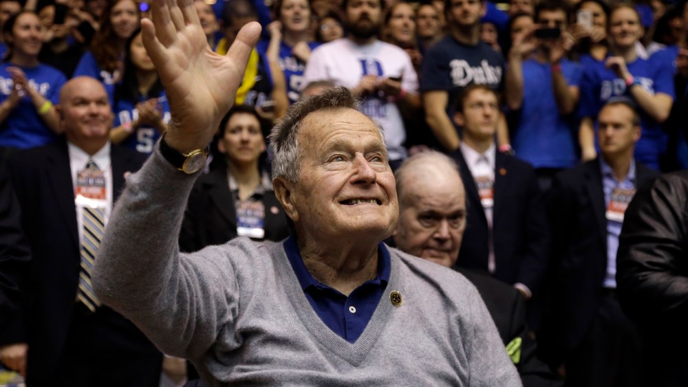 Former President George H.W. Bush is introduced during the first half of an NCAA college basketball in Durham, N.C., Jan. 18, 2014.