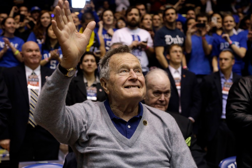 Former President George H.W. Bush is introduced during the first half of an NCAA college basketball in Durham, N.C., Jan. 18, 2014.