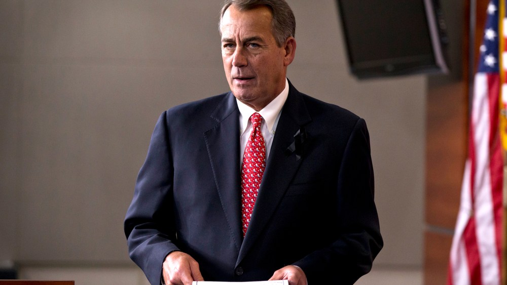 Speaker of the House John Boehner, R-Ohio, arrives to answer questions about the newly minted budget deal at a news conference on Capitol Hill in Washington, Dec. 12, 2013.