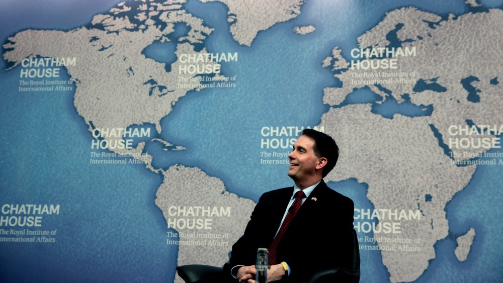 Wisconsin Gov. Scott Walker laughs as he is introduced prior to his speech at Chatham House in central London, Feb. 11, 2015. (Photo by Lefteris Pitarakis/AP)