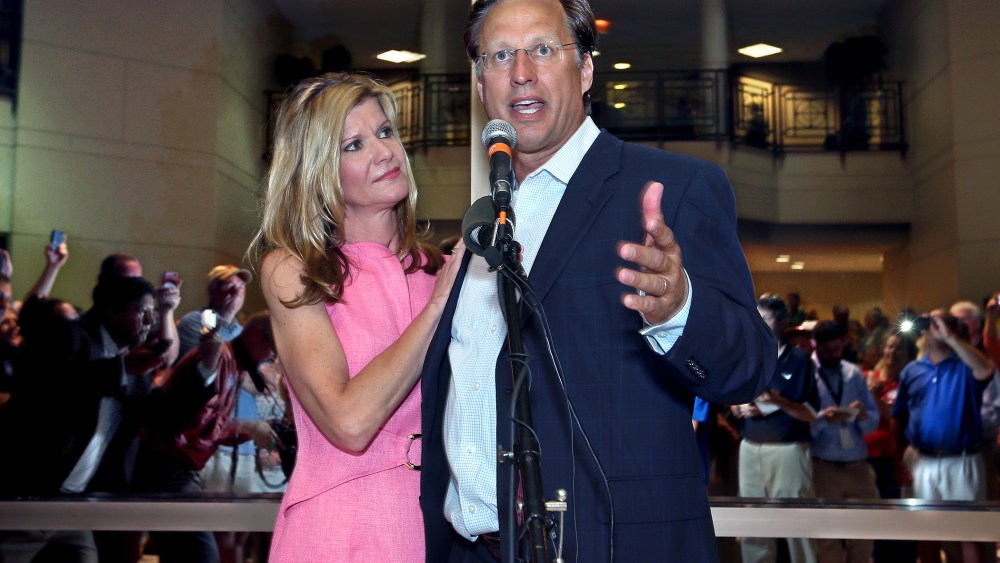 Dave Brat, stands his wife, Laura, as he speaks to supporters after defeating Republican Congressman Eric Cantor in the Republican primary for the 7th Congressional District in Virginia,  June 10, 2014.