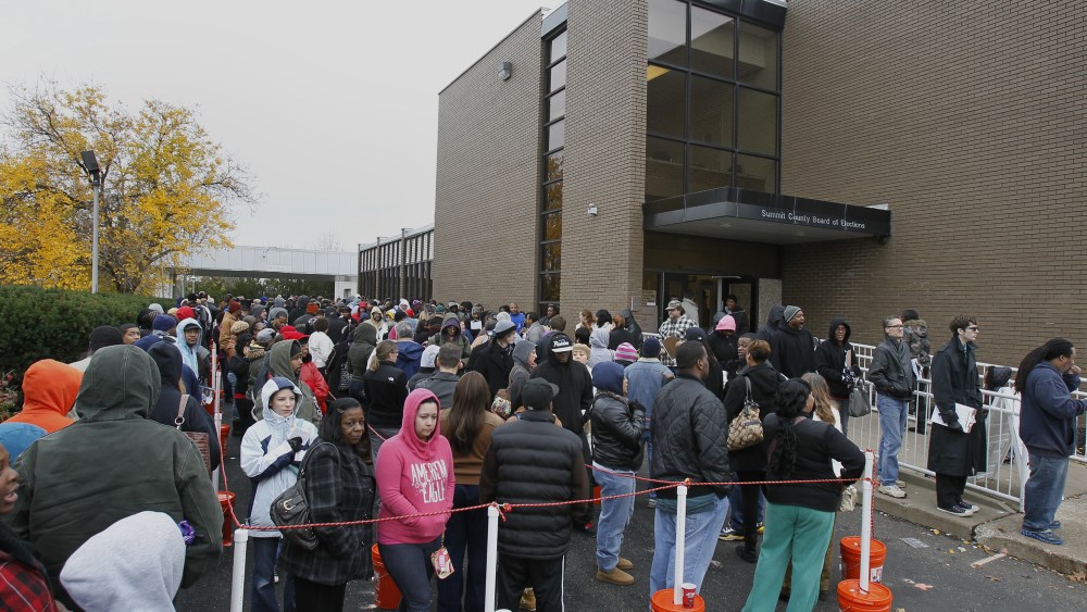 Voters wait hours in long lines to cast their early vote at the Summit County Board of Elections on Monday, Nov. 5, 2012, in Akron, Ohio. About 30 million people have already voted in 34 states and the District of Columbia, either by mail or in person....