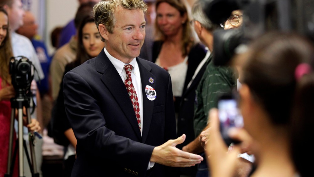 Sen. Rand Paul, R-Ky. is greeted by local Republicans before speaking at a gathering for local candidates, Aug. 5, 2014, in Hiawatha, Iowa.