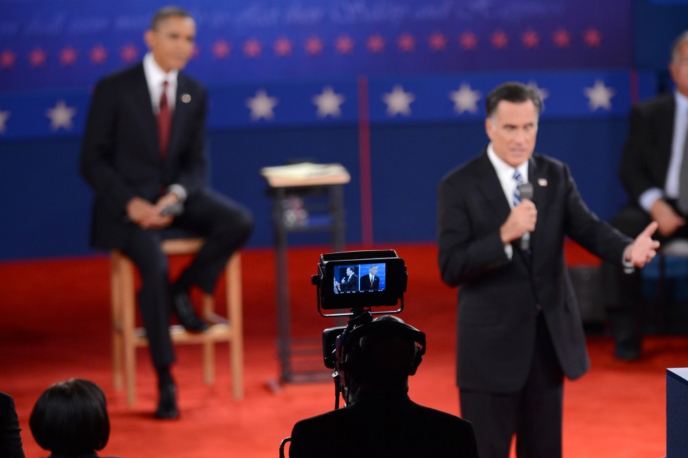 President Obama looks on as Mitt Romney, speaks during the second presidential debate at Hofstra University in Hempstead, Long Island, NY. (Photo: AP/Anthony Behar/Sipa USA)