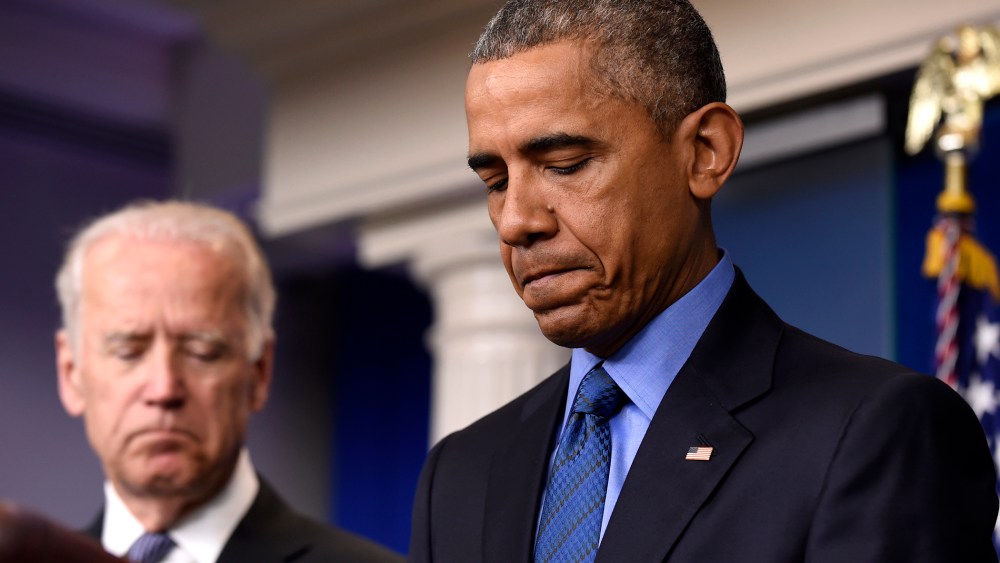 President Barack Obama, accompanied by Vice President Joe Biden, pauses while speaking in the Brady Press Briefing Room of the White House in Washington, D.C., June 18, 2015, on the church shooting in Charleston, S.C. (Photo by Susan Walsh/AP)