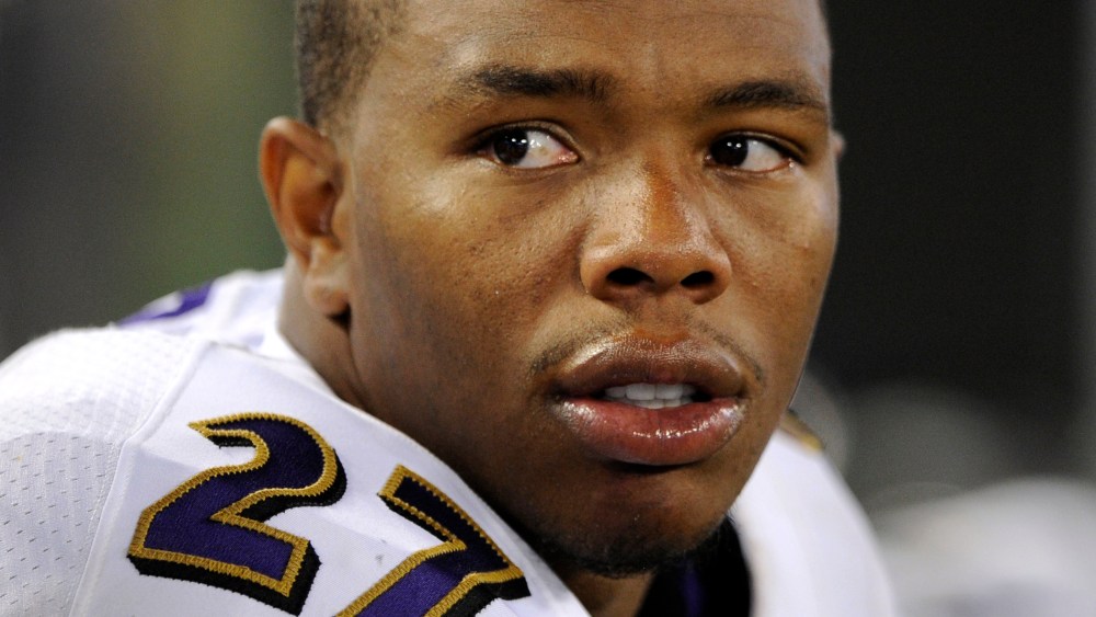 In this Aug. 7, 2014, file photo, Baltimore Ravens running back Ray Rice sits on the sideline in the first half of an NFL preseason football game in Baltimore, Md.
