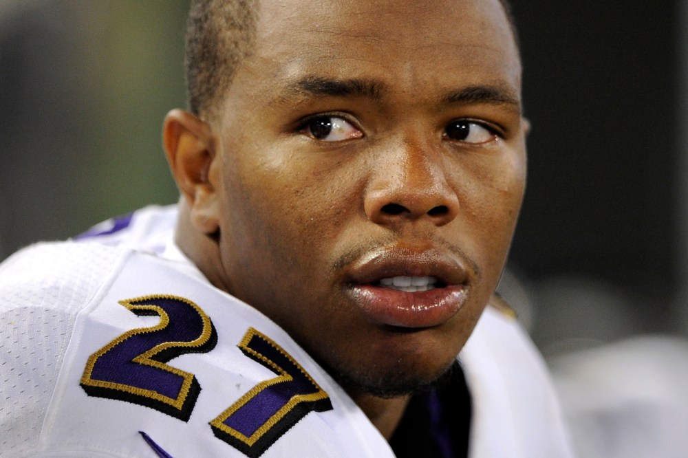In this Aug. 7, 2014, file photo, Baltimore Ravens running back Ray Rice sits on the sideline in the first half of an NFL preseason football game in Baltimore, Md.