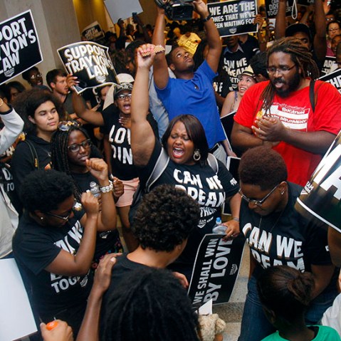 Dream Defenders and their supporters protest Friday, July 26, 2013 outside Florida Gov. Rick Scott's office in the Capitol in Tallahassee, Fla. (Photo by Phil Sears/AP)
