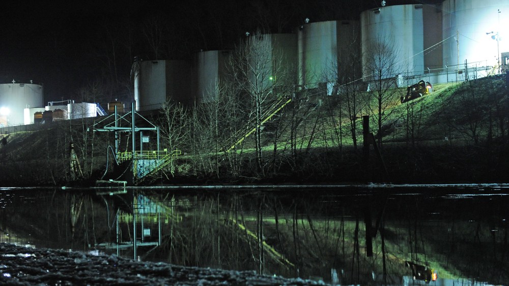 Crews clean up a chemical spill along the Elk River in Charleston, W.Va., Jan. 9, 2014.