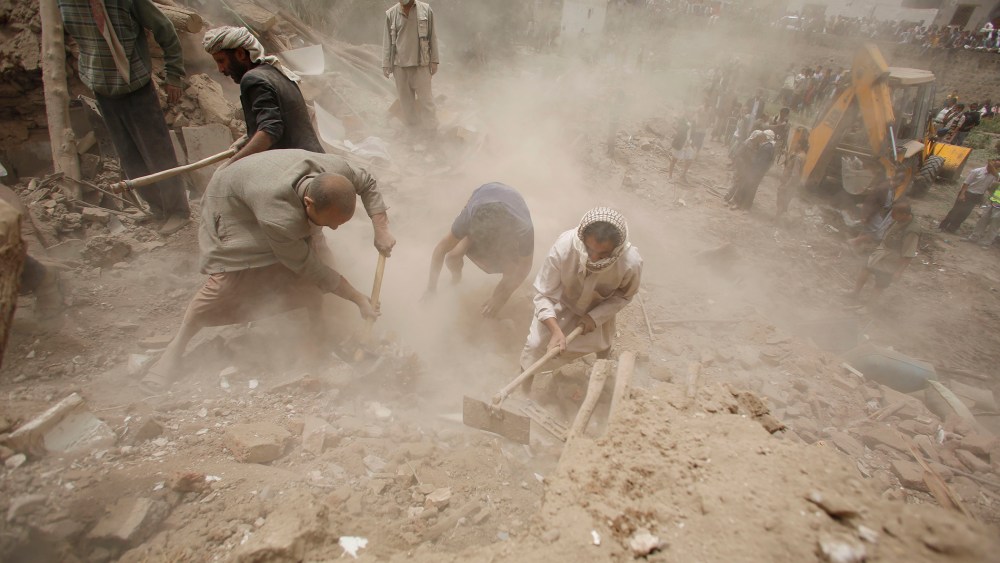 People search for survivors under the rubble of houses destroyed by Saudi airstrikes in the old city of Sanaa, Yemen, June 12, 2015. (Photo by Hani Mohammed/AP)