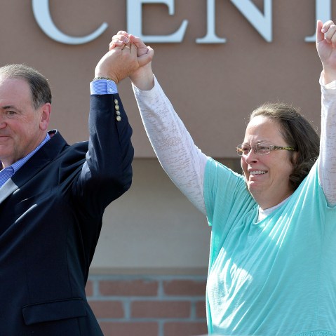 Rowan County Clerk Kim Davis, with Republican presidential candidate Mike Huckabee at her side, greets the crowd after being released from the Carter County Detention Center, Sep. 8, 2015, in Grayson, Ky. (Photo by Timothy D. Easley/AP)