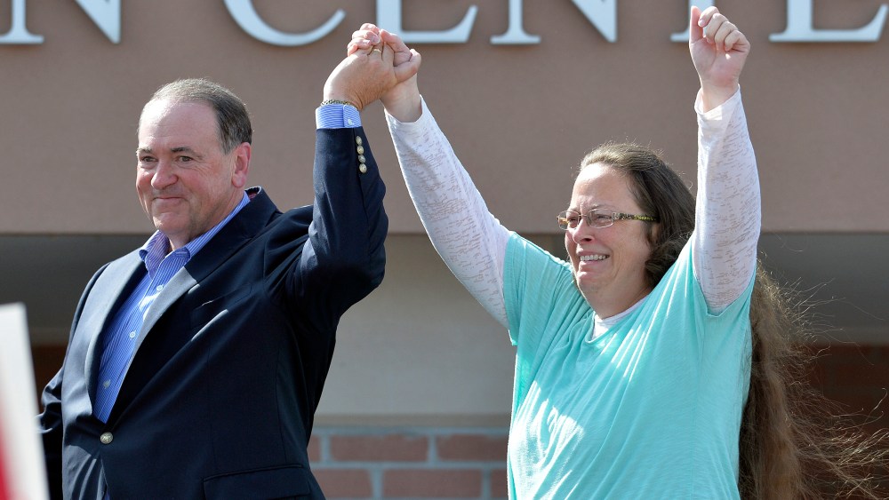 Rowan County Clerk Kim Davis, with Republican presidential candidate Mike Huckabee at her side, greets the crowd after being released from the Carter County Detention Center, Sep. 8, 2015, in Grayson, Ky. (Photo by Timothy D. Easley/AP)