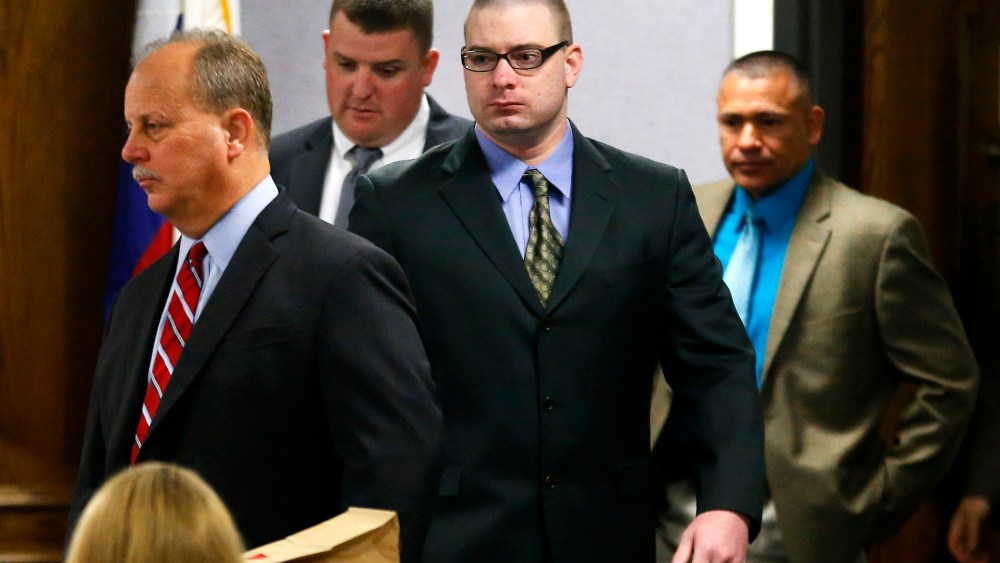 Former Marine Cpl. Eddie Ray Routh, center, is led into court by his defense attorney at the Erath County Donald R. Jones Justice Center in Stephenville, Texas, Feb. 12, 2015. (Photo by Tom Fox/The Dallas Morning News/Pool/AP)