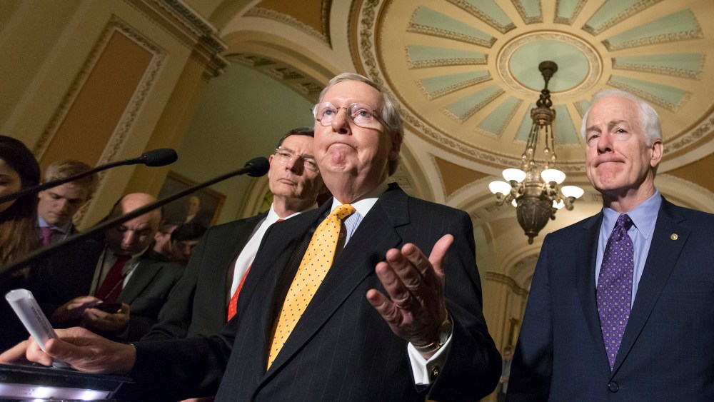 Senate Majority Leader Mitch McConnell, flanked by Sen. John Barrasso, R-Wyo., and Majority Whip John Cornyn, R-Texas, talks to reporters following a closed-door meeting at the Capitol in Washington, March 15, 2016. (Photo by J. Scott Applewhite/AP)