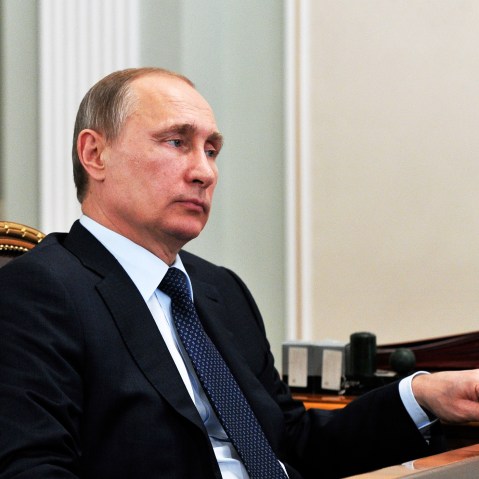 Russian President Vladimir Putin listens during a meeting in the Novo Ogaryovo residence, outside Moscow on, April 13, 2015. (Photo by Mikhail Klimentyev/AP)