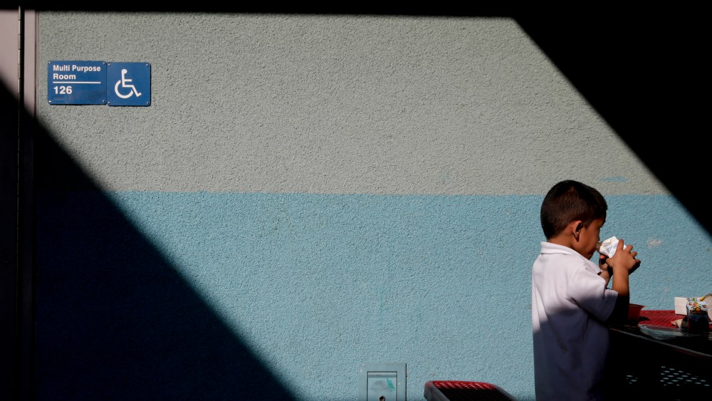 Joshua Beltran, 5, drinks his milk at Kingsley Elementary School, Jan. 13, 2015, in Los Angeles. Many of the students at the school in a low-income neighborhood of Los Angeles eat breakfast and lunch provided by the school. (Photo by Jae C. Hong/AP)