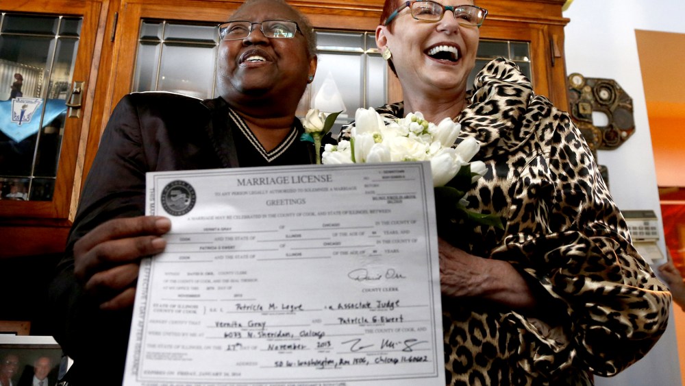 Vernita Gray, left, and Patricia Ewert hold their Illinois marriage license