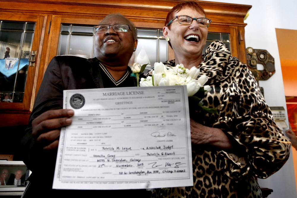 Vernita Gray, left, and Patricia Ewert hold their Illinois marriage license