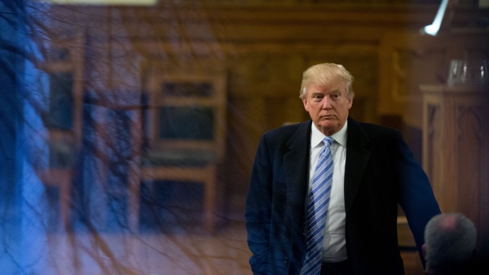 Republican presidential candidate Donald Trump arrives for service at First Presbyterian Church in Muscatine, Ia., Jan. 24, 2016. Trump will be holding a rally at Muscatine High School in the afternoon. (Photo by Andrew Harnik/AP)