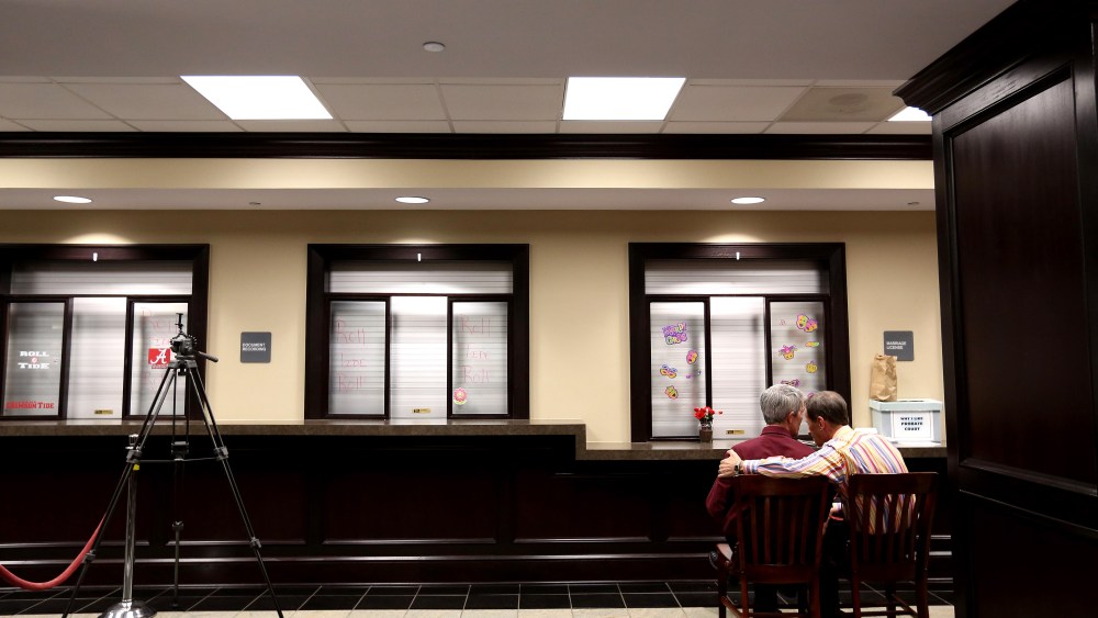 Milton Persinger, left, and Robert Povilat wait for a marriage license at the Mobile County Probate office, Feb. 10, 2015, in Mobile, Ala. (Photo by Sharon Steinmann/AP)