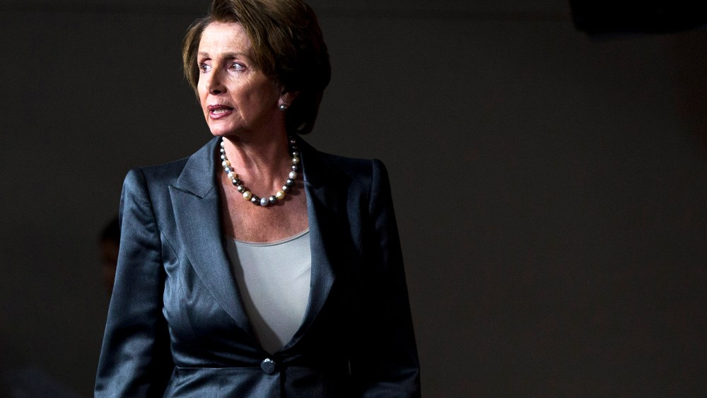 House Minority Leader Nancy Pelosi (D-Calif.) arrives for a news conference, Oct. 3, 2013, on Capitol Hill in Washington.
