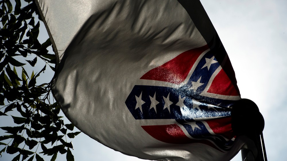 A Confederate flag flies next to the Alabama Confederate Memorial on the grounds of the Alabama Capitol building in Montgomery, Ala., June 22, 2015. (Photo by Albert Cesare/The Montgomery Advertiser/AP)