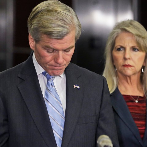 Former Virginia Gov. Bob McDonnell pauses while making a statement as his wife, Maureen, right, listens during a news conference in Richmond, Va., Jan. 21, 2014.