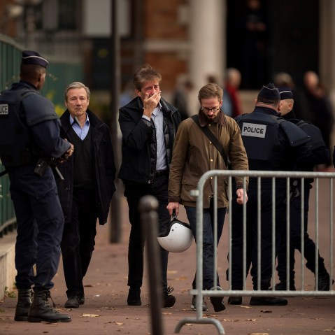 People react as they leave the morgue in Paris, Nov. 14, 2015. French President Francois Hollande vowed to attack ISIS without mercy for orchestrating the deadliest attacks inflicted on France since World War II. (Photo by Daniel Ochoa de Olza/AP)