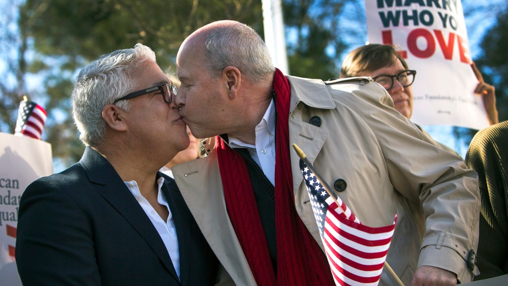 Robert Roman and Claus Ihlemann, of Virginia Beach, celebrate a ruling that declared Virginia's same-sex marriage ban unconstitutional on Feb. 14, 2014, in Norfolk, Va.
