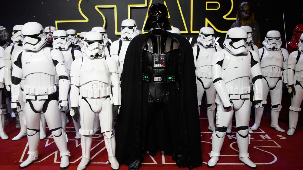 Actors dressed as Stormtroopers and Darth Vader pose for photographers upon arrival at the European premiere of the film 'Star Wars: The Force Awakens ' in London, Dec. 16, 2015. (Photo by Jonathan Short/Invision/AP)