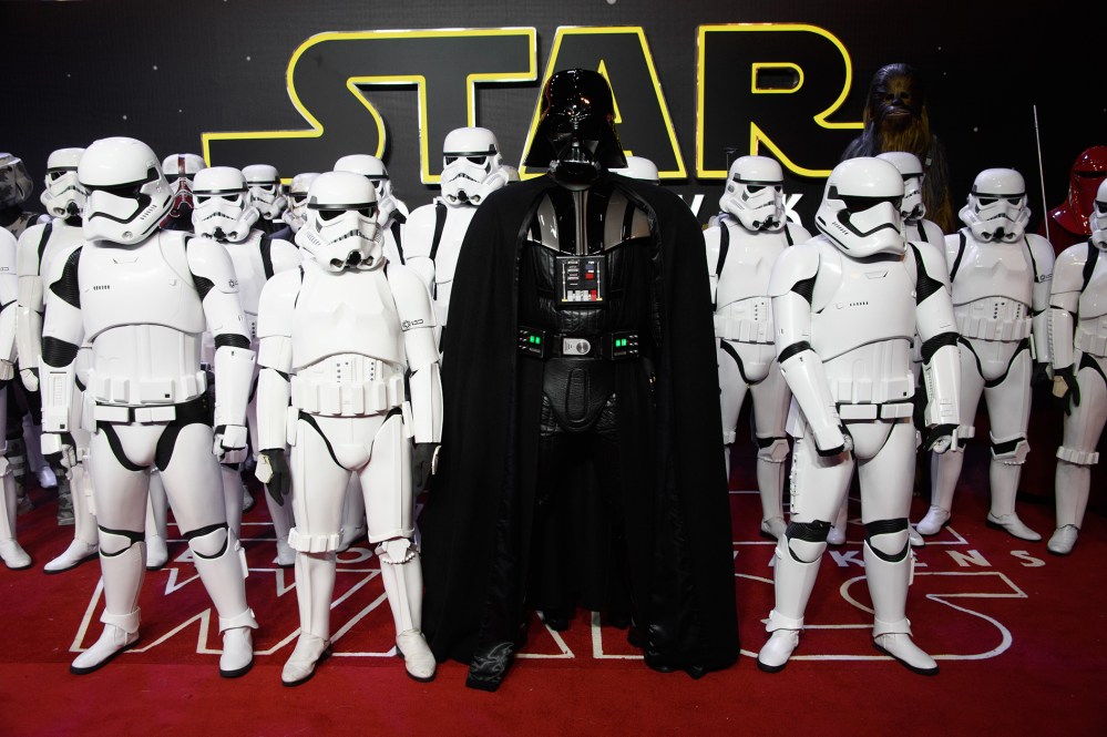 Actors dressed as Stormtroopers and Darth Vader pose for photographers upon arrival at the European premiere of the film 'Star Wars: The Force Awakens ' in London, Dec. 16, 2015. (Photo by Jonathan Short/Invision/AP)