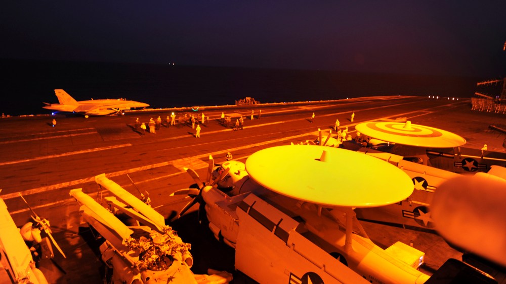 In this file photo released by the U.S. Navy on Tuesday, Sept. 23, 2014, A-18C Hornet prepares to launch from the flight deck to conduct strike missions against Islamic State group targets, in the Arabian Gulf. (Robert Burck/U.S. Navy-File/AP)